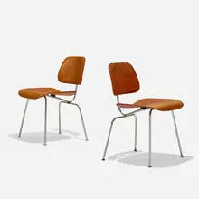 DCMs, pair by Charles and Ray Eames, 1946 / 1948, molded aniline-dyed birch plywood, chrome-plated steel, rubber, sold Feb 2019