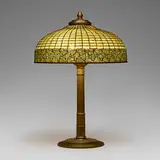 Greek Key table lamp by Tiffany Studios, c. 1910, leaded glass, acid-etched and gilt bronze, sold Mar 2024
