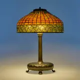 Greek Key table lamp by Tiffany Studios, c. 1910, leaded glass, patinated bronze, sold Mar 2024