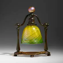 Bell-shaped table lamp by Tiffany Studios, c. 1910, patinated bronze, hand-blown Favrile glass, sold Mar 2024