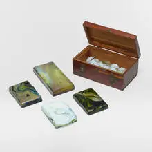 Collection of tiles by attribution Tiffany Studios, c. 1910, molded Favrile glass, sold Mar 2024
