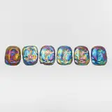 attribution Tiffany Studios, Collection of six Turtleback tiles, c. 1910, molded Favrile glass