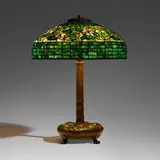 Vine Ornament (Oak and Acorn) table lamp by Tiffany Studios, c. 1910, leaded glass, patinated bronze, sold Mar 2024