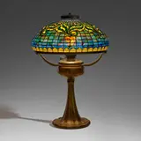 Tyler Scroll table lamp by Tiffany Studios, c. 1910, leaded glass, patinated bronze, sold Mar 2024