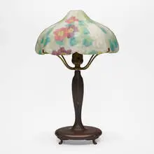 Pairpoint, Puffy boudoir lamp with nasturtiums, c. 1915, reverse-painted acid-etched glass, patinated metal