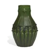 large vase with carved leaf and flower decoration by Eva Russell for Grueby Faience Company, sold Jun 2021
