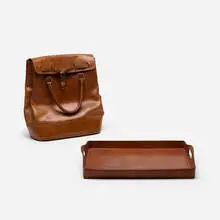 bag and tray by Carl Auböck, c. 1950, leather, brass, sold Jan 2019