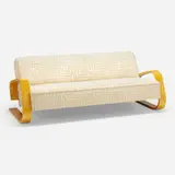 Sofa by Alvar Aalto, c. 1980, upholstery, laminated birch, sold Mar 2024
