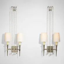 Sconces model 12, pair by Tommi Parzinger, c. 1955, chrome-plated brass, glass, waxed cardboard, sold Mar 2024