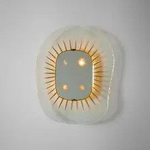 illuminated mirror, model 1657 by Max Ingrand, 1958, chisel-cut, carved and polished crystal with silver details, mirrored glass, brass, enameled aluminum, sold Oct 2018