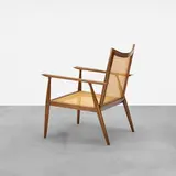 Paul McCobb, Planner Group lounge chair, c. 1953, stained maple, cane