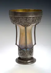 Circa 1900 by Loetz, An Art Nouveau pewter mounted iridescent glass vase,, sold Nov 2004