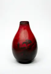 Royal Doulton, A Flambé Vase,, of ovoid shape, transfer printed with a highland hunter, his horse laden with a large deer, under a deep flambé glaze