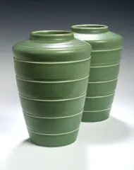 Keith Murray, A pair of Wedgwood green ground vases,