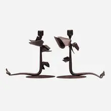 Tuft candleholders, pair by Albert Paley, 1993, forged mild steel with a blackened patina, sold Mar 2024