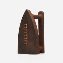 Cadeau by Man Ray, cast iron, steel tacks, sold Mar 2024