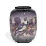 porcelain vase with a colorful scene of songbirds by Edward T. Hurley for Rookwood Pottery, sold Jun 2021
