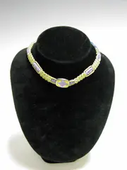 A Georg Jensen Choker, by Naja Salto, the three panels enamelled in purple, yellow and red to chain and clasp,, offered Nov 2004