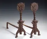 Christopher Dresser, A pair of Aesthetic Movement cast iron fire dogs,