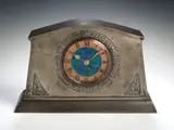 Liberty & Co., A pewter and enamel mantel clock,