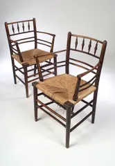 A pair of 'Sussex' chairs, by Morris & Co., sold Nov 2004