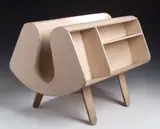 An Isokon Penguin Donkey Bookcase by Egon Riss and Jack Pritchard, white painted bent plywood U-shape form incorporating shelves on tapering legs,, sold Nov 2004
