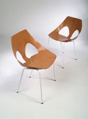 Carl Jacobs, A set of six Jason Chairs, manufactured by Kandya, the inter-locking back and seat of moulded plywood on later painted rod supports,