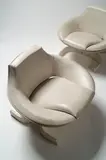 Oswaldo Borsani, A pair of Canada Chairs, manufactured by Tecno, lacquered white laminated shells with vinyl upholstery,