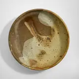Plate by Toshiko Takaezu, c. 1965, glazed stoneware, sold Feb 2024