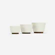 planters, set of three by Malcolm Leland, c. 1964, glazed stoneware, redwood, sold Sep 2018