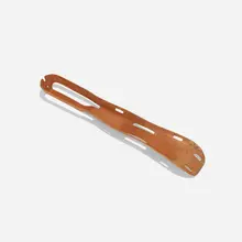 Charles and Ray Eames, leg splint, 1943, molded mahogany plywood