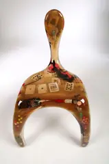 Finn Stone, An Amorphic Chair, hand made fibre-glass shell incorporating glitter, cards and bottle tops,