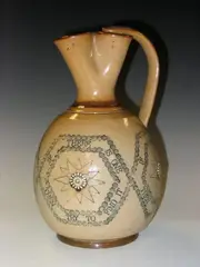 Doulton Lambeth, A stoneware motto jug, decorated by Alice Caffin and dated 1884,, A stoneware motto jug, decorated by Alice Caffin and dated 1884,