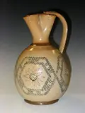 Doulton Lambeth, A stoneware motto jug, decorated by Alice Caffin and dated 1884,, A stoneware motto jug, decorated by Alice Caffin and dated 1884,
