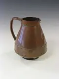 Doulton Lambeth, A 'Silicon Ware' jug,, modelled in the form of a copper vessel,