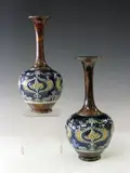Royal Doulton, A pair of Art Nouveau stoneware vases,