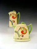 Royal Doulton, A teapot, cover and stand,
