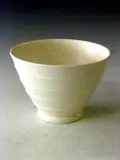 Keith Murray, A white Wedgwood vase,