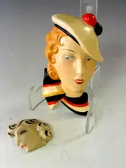 A small wall mask, by Clarice Cliff, sold May 2004