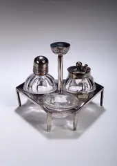 A Hukin & Heath electroplated cruet set, by Dr. Chistopher Dresser, sold May 2004