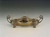 An electroplated jardiniere and cut glass liner, by Württembergische Metallwarren Fabrik, An electroplated jardiniere and cut glass liner,, offered May 2004