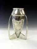 A 'Tudric' polished pewter vase, designed by Archibald Knox, by Liberty & Co., A 'Tudric' polished pewter vase, designed by Archibald Knox,, offered May 2004