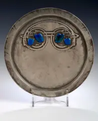 A Tudric circular pewter and enamel tray, designed by Archibald Knox, by Liberty & Co., A Tudric circular pewter and enamel tray, designed by Archibald Knox,, sold May 2004