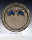 Liberty & Co., A Tudric circular pewter and enamel tray, designed by Archibald Knox,, A Tudric circular pewter and enamel tray, designed by Archibald Knox,