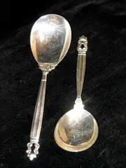 Two 'Acorn' pattern serving spoons, by Georg Jensen, sold May 2004