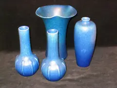 Pilkingtons Royal Lancastrian, a pair of gourd-shaped vases,, in a speckled blue glaze