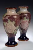 Bessie Newberry, for Royal Doulton, A pair of stoneware vases,