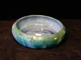 Denise Wren, An Oxshott Pottery circular bowl,, in a streaked green/blue glaze,
