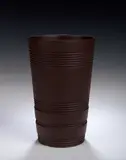 Keith Murray, A Wedgwood brown basalt vase,