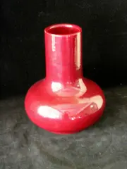 A vase, by Clement Massier, in a sang de boeuf glaze,, sold Nov 2003